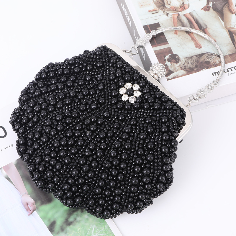 حقيبة يد فاخرة من اللؤلؤ صدفي  - مراجعة Luxury Bags Direct وسعره