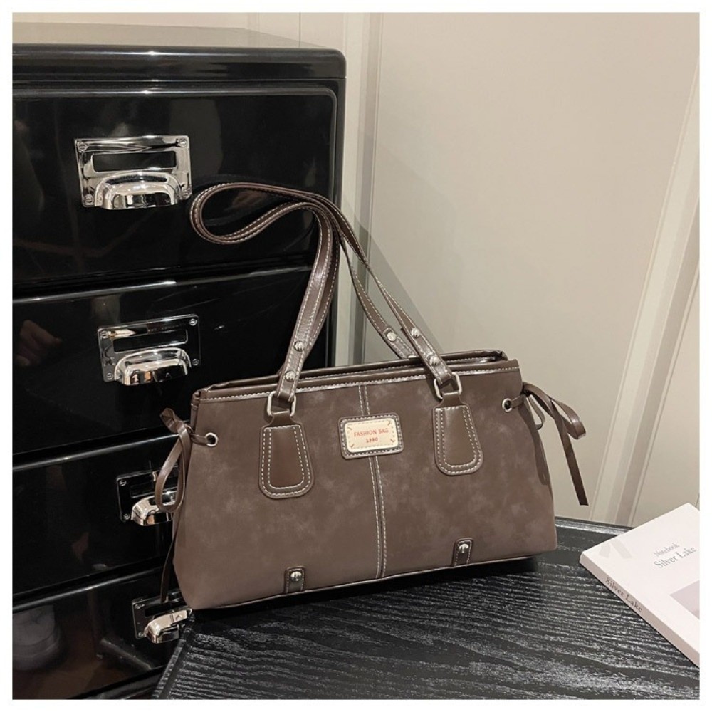 حقيبة يد مينيماليستية من الجلد - مراجعة Structured Handbag Top Handle وسعره
