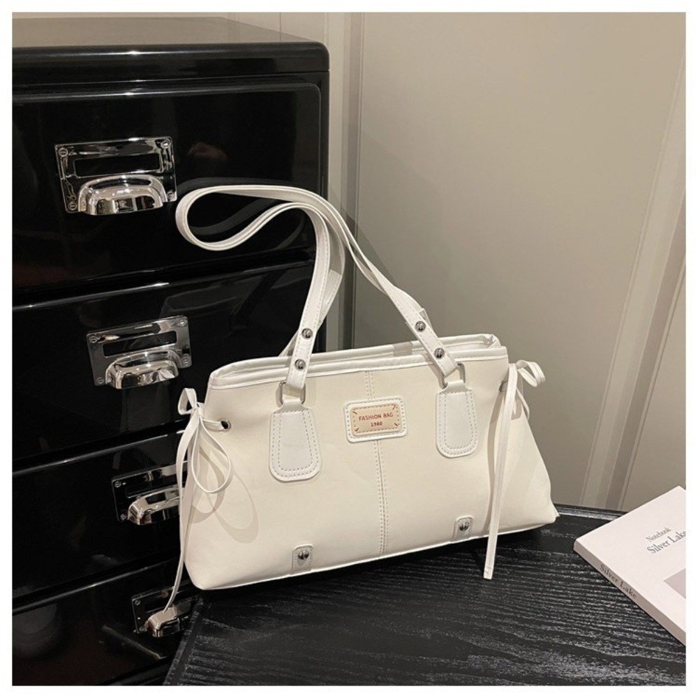 حقيبة يد مينيماليستية من الجلد - مراجعة Structured Handbag Top Handle وسعره